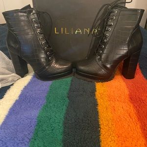 Black tie up Liliana Booties , size 8.5. Not Leather . New in the box.